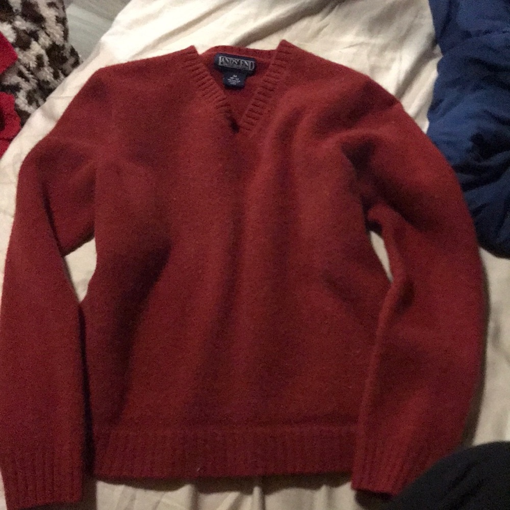 This reddish orange sweater